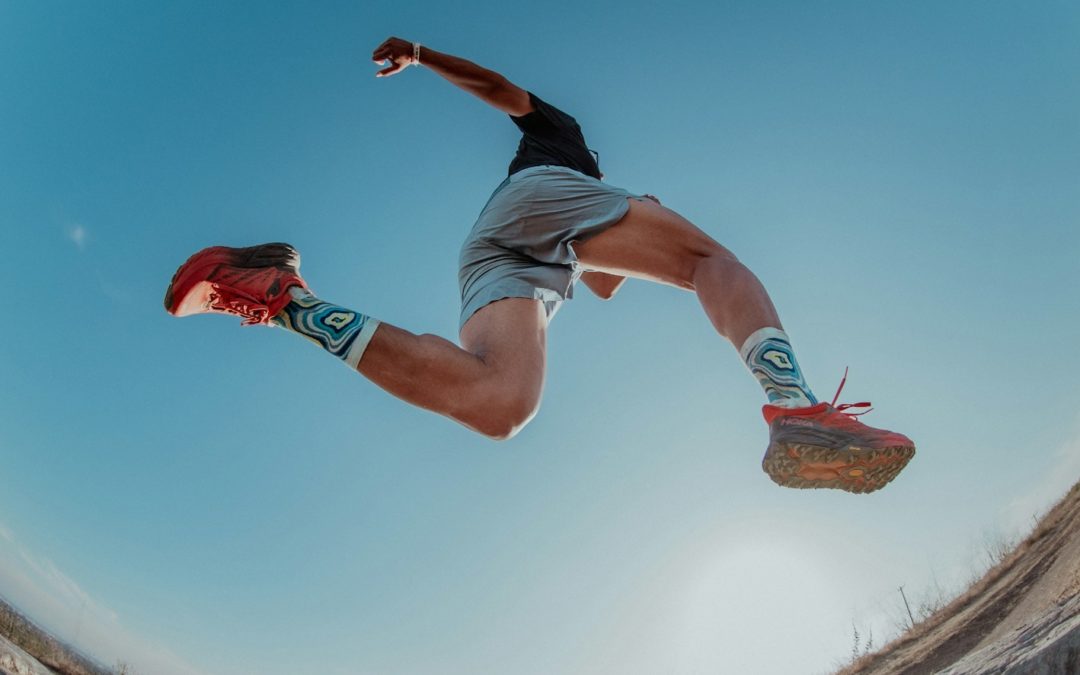 a man flying through the air while riding a skateboard